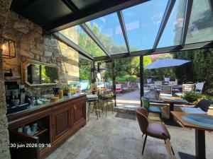 a kitchen and dining room with a large glass window at Villa Arca in Les Arcs sur Argens