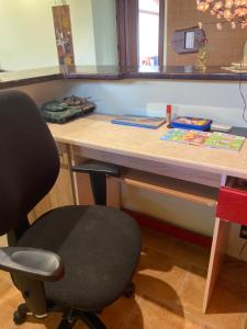 a desk with a chair in front of a table at Texaco in Kazimierz Dolny