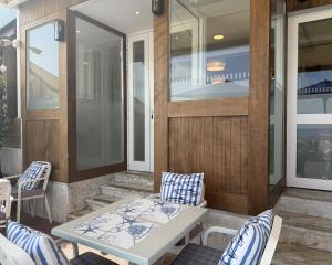 a patio with a table and chairs on a porch at Hotel Rosamar Maxim 4*- Adults Only in Lloret de Mar