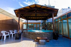 a patio with a hot tub and tables and chairs at Ikebukuro Royal Hotel in Tokyo