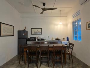 a kitchen and dining room with a table and chairs at Zen Retreat KL in Kuala Lumpur