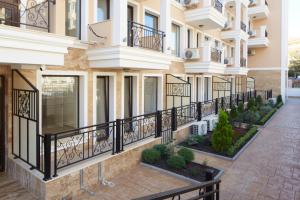 a row of balconies on a building at Polarstar Beach Resort - Premium Apartments in Sveti Vlas +20 photos