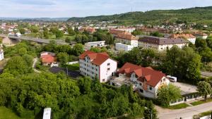 an aerial view of a town with houses and trees at Pensiunea Florica in Piteşti +19 photos