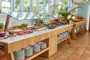 a buffet line with many different types of food at Apartamentos San Miguel Park & Esmeralda Mar in Puerto de San Miguel +36 photos