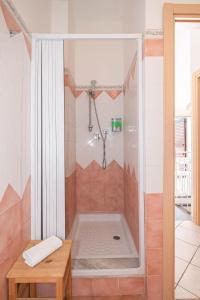 a bathroom with a shower with a tub at New Naxian Holidays in Giardini Naxos +40 photos