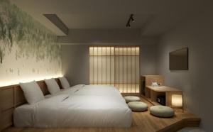 a bedroom with a large white bed and a window at B:CONTE Asakusa in Tokyo