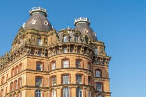 an old building with two domes on top of it at The Grand Scarborough in Scarborough