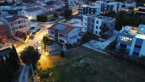an aerial view of a city at night at Apartments Vukalovic in Medulin