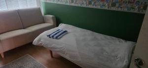 a living room with a bed and a couch at Pankkikallio 16 in Sorsakoski