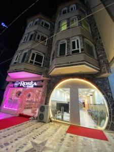 a building with a round window in front of it at Bani motel in Duhok