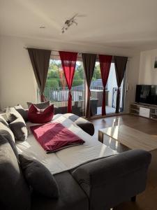 a couch with pillows on it in a living room at See-Eck in Überlingen