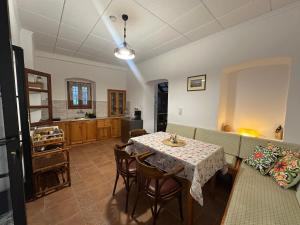 a living room with a table and a couch at Casa Filita 'Old Town Traditional House' in Kos