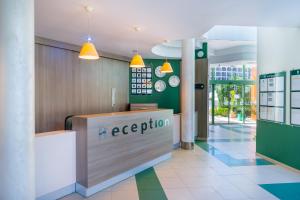 a reception area of a restaurant with a reception desk at MPM Hotel Kalina Garden - All Inclusive in Sunny Beach