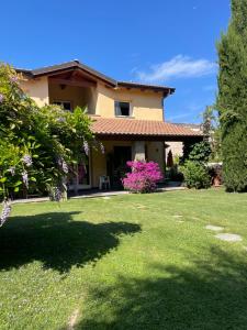 a house with a lawn in front of it at Villa Marlene B&B in Albenga