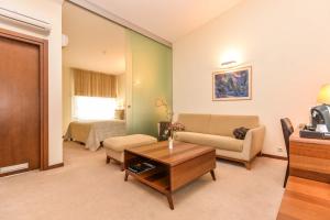 a living room with a couch and a table at Guest House Aštuoni in Palanga