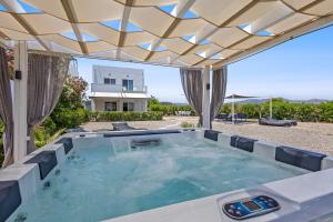 a hot tub in the backyard of a house at S-EVA RESORT in Kolymbia