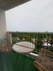 a table and chairs on a balcony with a view at At LBS 888 Condo Unit Rental-Full Relaxing Seaview 304-10Flr in Lapu Lapu City