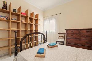 a bedroom with a bed with blue towels on it at Beach 2-bedroom in Los Cristianos in Los Cristianos +32 photos