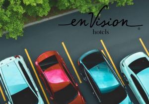 a group of cars parked in a parking lot at enVision Hotel Worcester Downtown in Worcester