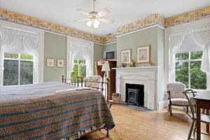 a bedroom with a bed and a fireplace at Rockwood Manor Bed & Breakfast in Dublin