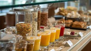 a counter with many glasses of different types of food at enVision Hotel Worcester Downtown in Worcester +7 photos