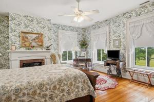 a bedroom with a bed and a fireplace at Rockwood Manor Bed & Breakfast in Dublin
