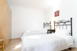 A bed or beds in a room at Villa César
