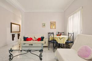 a living room with a couch and a table at Beach 2-bedroom in Los Cristianos in Los Cristianos