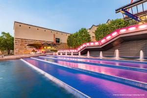 an indoor swimming pool with a water slide at Holiday Inn Stuttgart by IHG in Stuttgart