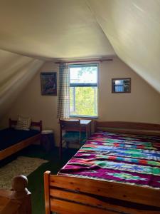 a bedroom with a large bed in a tent at Dębowy Zakątek in Dębowo