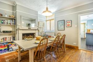 a kitchen and dining room with a table and chairs at 4 Bed in Reydon oc-l30001 in Reydon