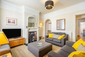 a living room with a couch and a tv at 4 Bed in Reydon oc-l30001 in Reydon