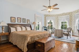 a bedroom with a bed and a ceiling fan at Rockwood Manor Bed & Breakfast in Dublin +17 photos
