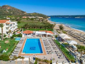 an aerial view of a resort with a swimming pool and the beach at GK Beach Hotel in Kalyves