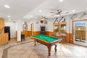 a living room with a pool table in it at 6118 - Ferrari II in Nags Head