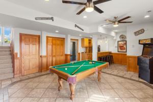 a living room with a pool table in it at 6118 - Ferrari II in Nags Head +82 photos