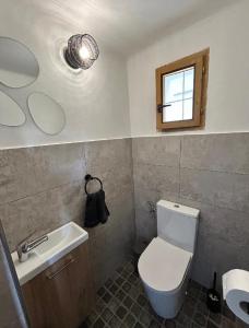 a bathroom with a toilet and a sink and a mirror at Na Špici Bítov in Bítov +18 photos