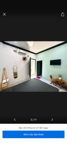 a picture of a living room with a tv at Hera motel in Xã Như Lâm