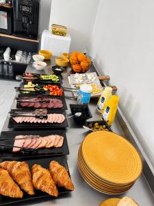 a buffet with many different types of food on it at Rosetti Inn in Cluj-Napoca +56 photos