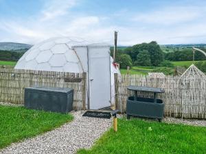 a soccer ball dome and a table in a yard at Pendle Hill Dome - Ukc9599 in Earby