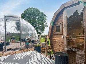 an outside view of a house with a glass dome at Pendle Hill Dome - Ukc9599 in Earby +13 photos