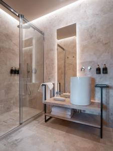 a bathroom with a sink and a shower at Tenuta Bartoli in San Gimignano +33 photos
