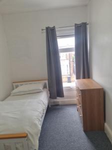 a small bedroom with a bed and a window at City view place, City Centre in Chesterton +6 photos