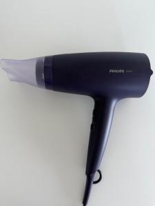 a hair dryer sitting on top of a white background at Apartment „Blue“ in Mandre