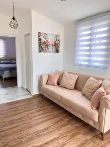 a living room with a couch and a bedroom at Apartman Jana in Bar