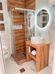 a bathroom with a sink and a shower at Apartman Jana in Bar +14 photos