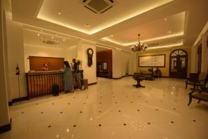 two people standing in a hallway of a building at Hotel Nippon Colombo in Colombo