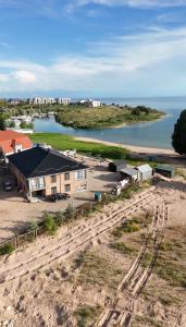 an aerial view of a house next to a body of water at Парус in Cholpon-Ata