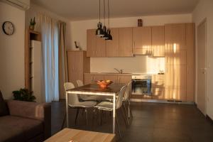 a kitchen with a table and chairs in a room at Albergo Vittoria in Rimini