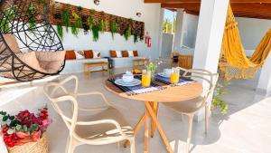 a dining room with a table and chairs at Pousada Vista Chic in Cunha +76 photos